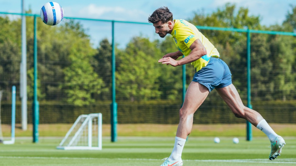 HEADS UP: Ruben Dias powers into action.