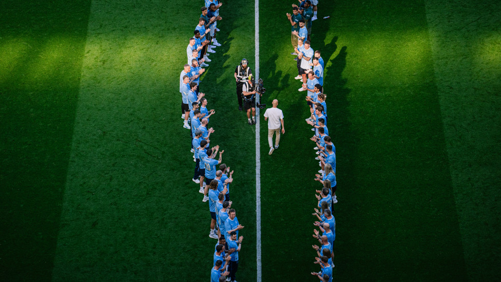 WALKWAY  : Guardiola receives his guard of honour from staff and players alike. 