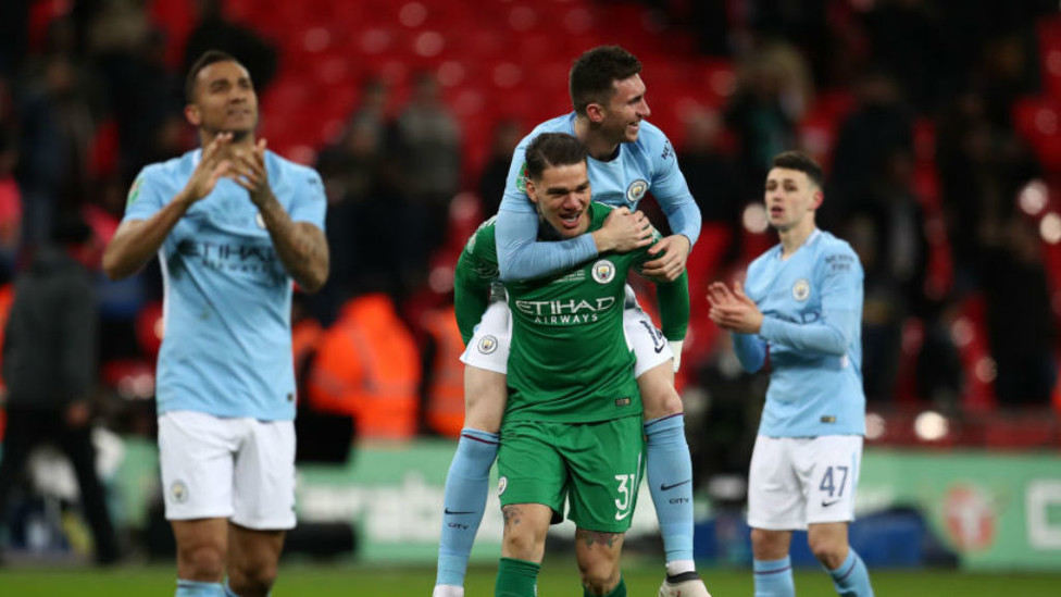 UP FOR THE CUP : Aymeric and Ederson celebrate after our 2018 Carabao Cup final triumph over Arsenal