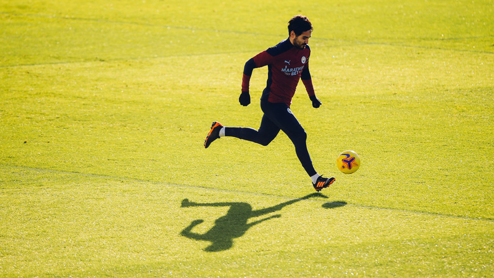 SHADOWPLAY: Ilkay Gundogan is silhouetted against the CFA training backdrop