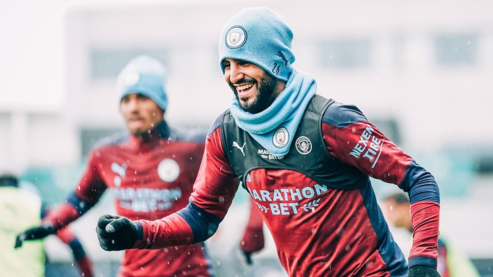 WRAPPED UP : It was definitely hat and snood weather for the lads today!