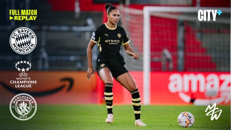 A Manchester City player in black kit with yellow accents controls the ball in a UEFA Women's Champions League match against Bayern Munich. Logos for both clubs and UEFA are visible.