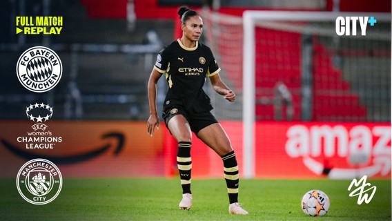 A Manchester City player in black kit with yellow accents controls the ball in a UEFA Women's Champions League match against Bayern Munich. Logos for both clubs and UEFA are visible.
