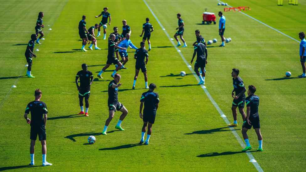 SHADOW PLAY : The City squad go through their warm-up drills