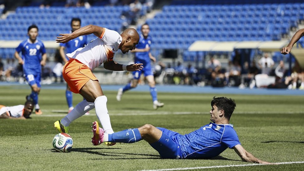 SLIDE RULE: Abdukodir Khusanov in the thick of the action for Uzbekistan
