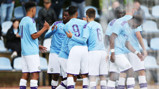 BOYS IN BLUE: City celebrate the opening goal