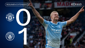 Image showing a football player celebrating in a Manchester City kit, with the score Manchester United 0 - 1 Manchester City displayed alongside the logos of both teams.