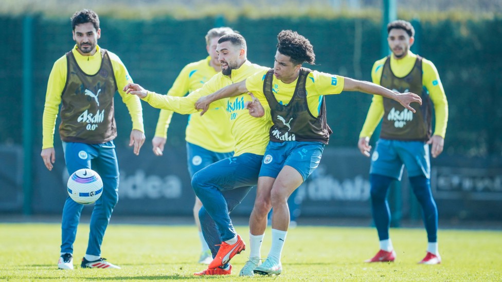 FIGHTING FOR THE BALL : Rico Lewis and Kovacic go toe to toe