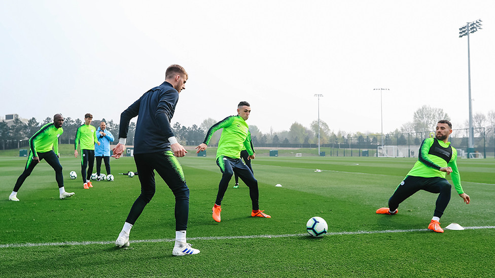 CLOSING IN : Phil Foden looks to intercept play