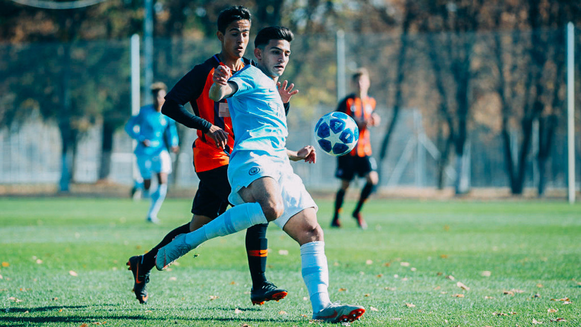 EYES ON THE BALL: Nabil Touaizi holds off his marker
