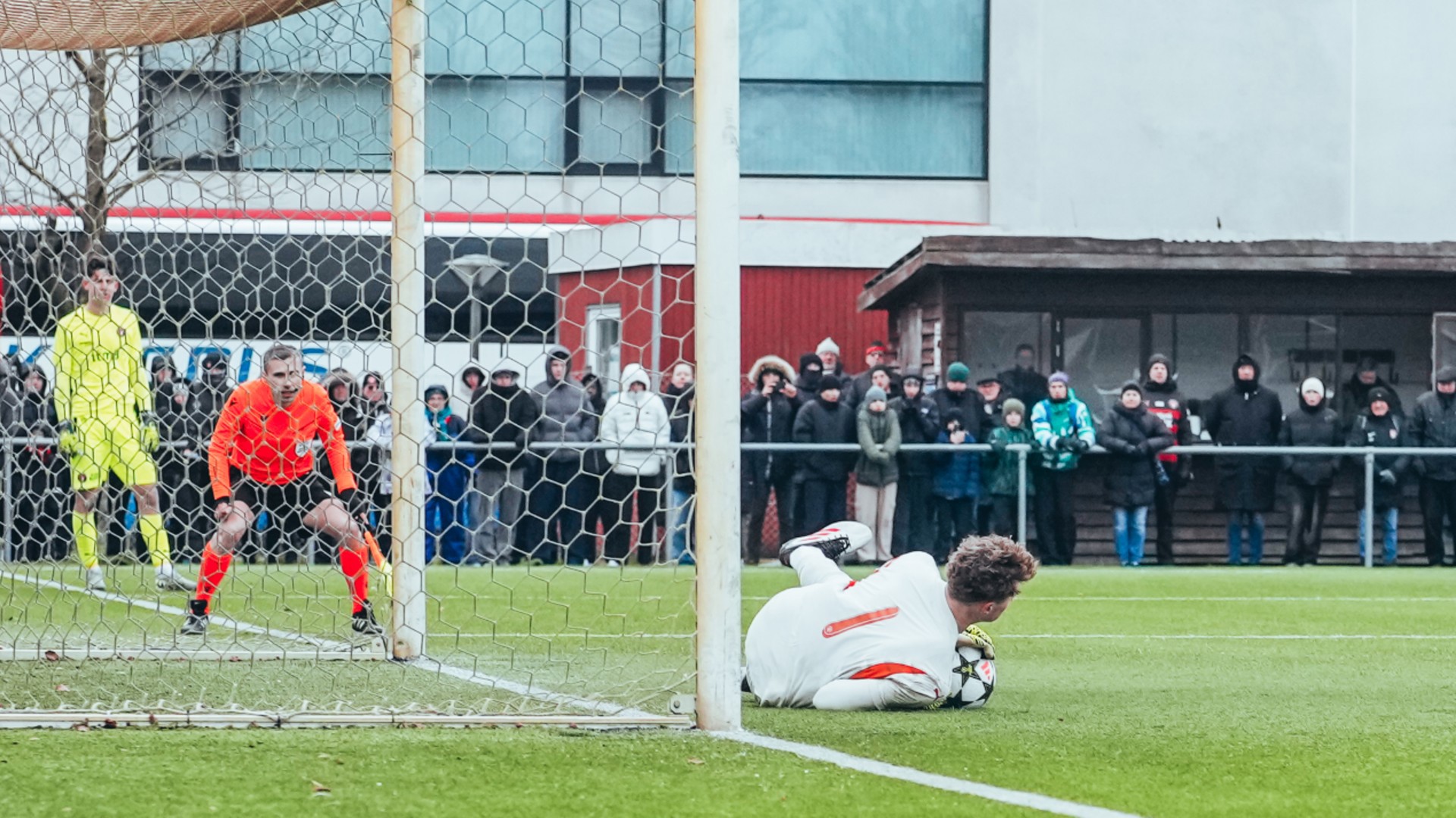 SPOT ON: Oliver Whatmuff makes the crucial spot-kick save