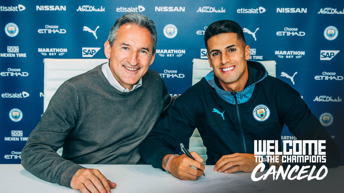 SIGNED: Joao Cancelo pens his contract with Txiki Begiristain.