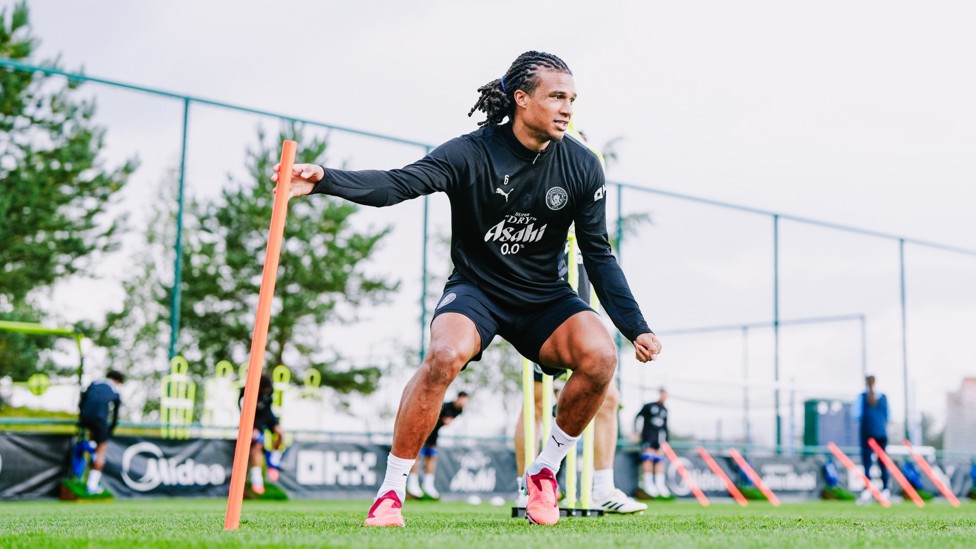 AGILE AKE : Nathan Ake twists and turns in the drill. 