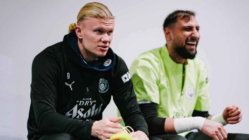 READY TO GO : Erling Haaland and Gianluigi Donnarumma put on their boots. 