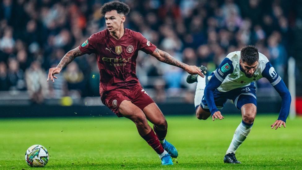 MY BALL : Nico O'Reilly shrugs off a challenge against Spurs