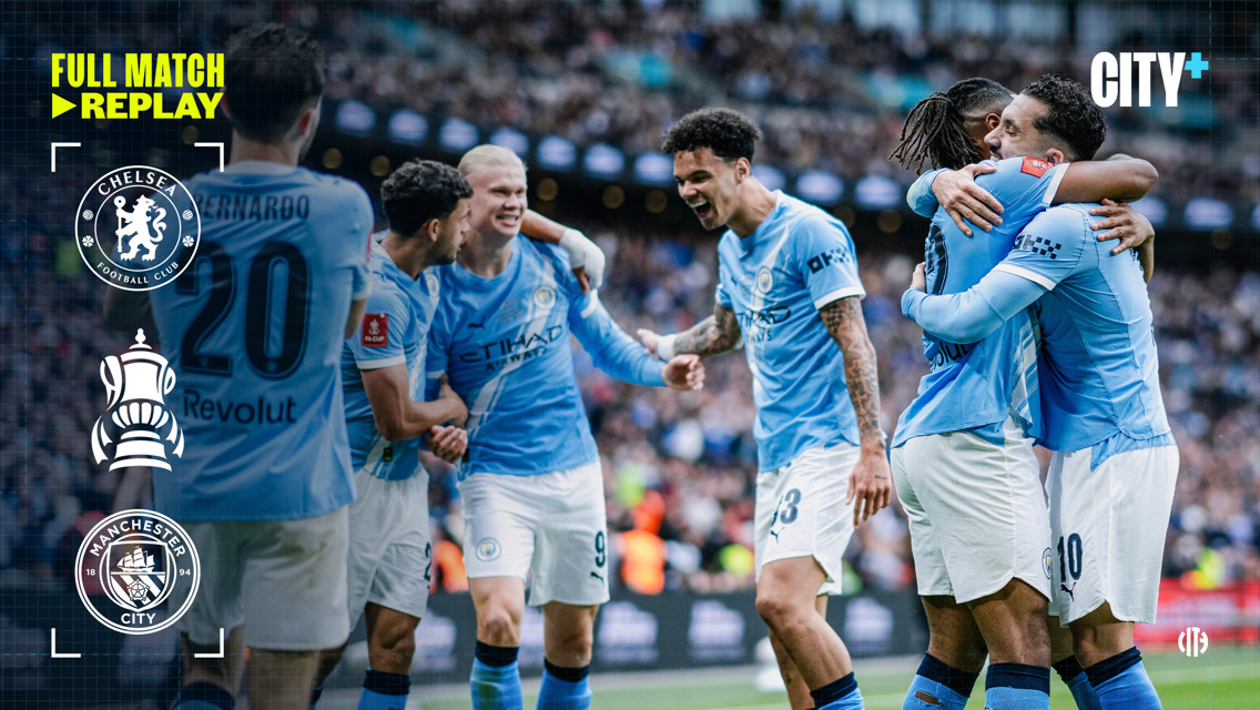 Manchester City players celebrating during a game against Chelsea with FA Cup and logos displayed on the side.