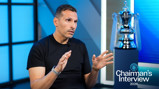 A person in a black shirt is interviewed in front of a silver FA Cup trophy. Text reads 'Chairman's Interview 2026' with the Manchester City logo.