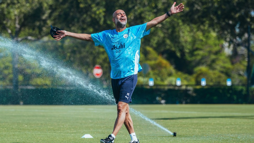 Magic sprinkler : Pep Guardiola looked happy in the sunshine