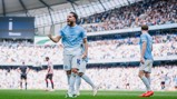 Manchester City player celebrating a goal during a football match at Etihad Stadium.