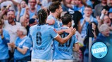 Players in Manchester City kit celebrating a goal, with one labeled Aké. Fans visible in the background. An 'Official Verdict' badge is present.