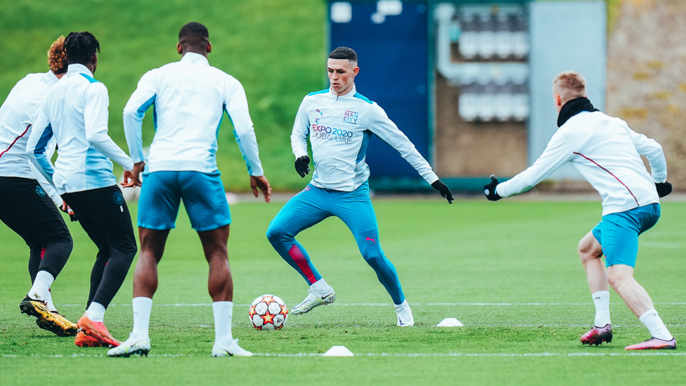 QUICK FEET : Phil Foden gets ready to shift the play