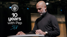 A person at a podium with the Manchester City logo and text '10 years with Pep'