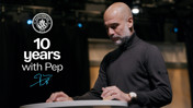 A person at a podium with the Manchester City logo and text '10 years with Pep'