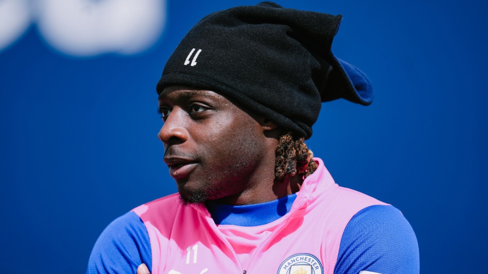 HAT TRICK: Jeremy Doku sports some nifty headwear to keep out the April chill.