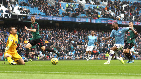 MAN ON FIRE: Raheem Sterling strikes a minute after the restart, firing into the near post