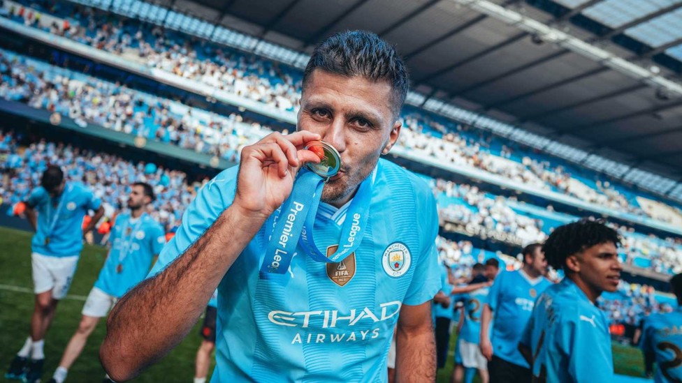 SEALED WITH A KISS : Rodri celebrates a fourth straight Premier League title win on the pitch at the Etihad.