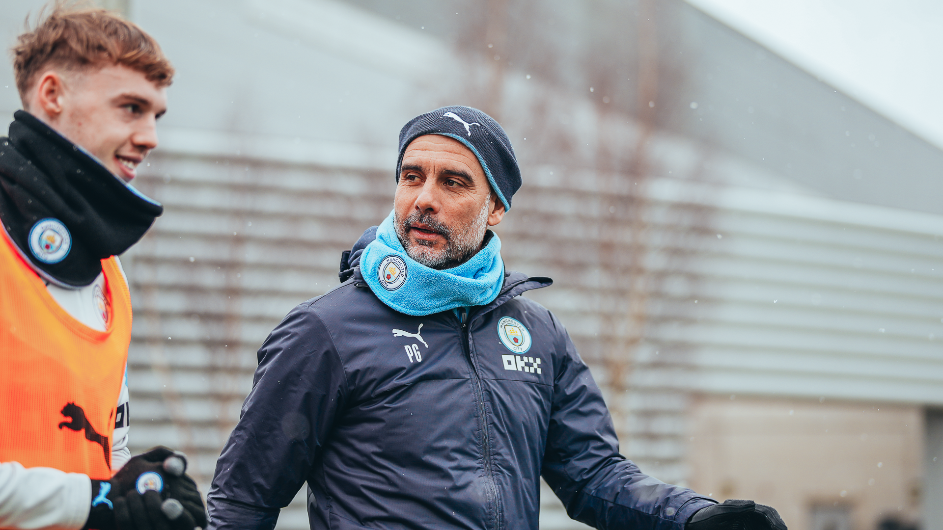 PEP TALK : Pep Guardiola chats to Cole Palmer as they make their way out to training