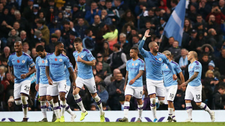 SQUAD GOALS: The team get together to celebrate the late winner. 
