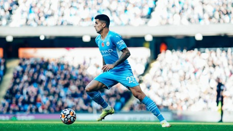WOW JOAO: Cancelo leads City up the pitch.