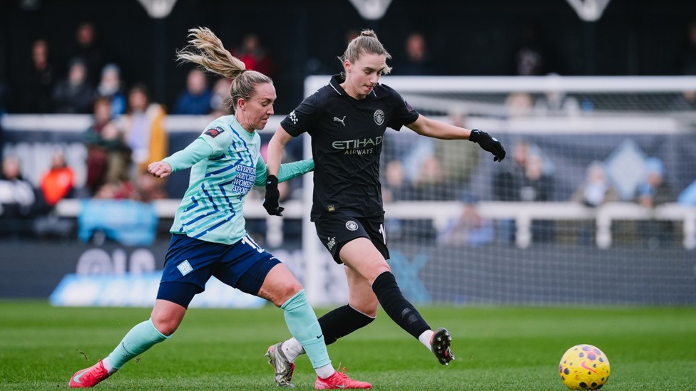IN THE THICK OF IT : Vivianne Miedema battles for possession