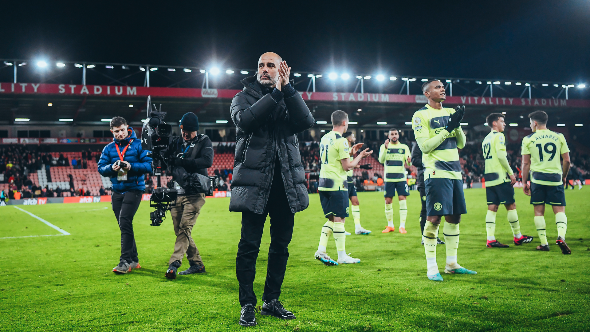 THE BOSS : Pep Guardiola applauds the away faithful on full-time.
