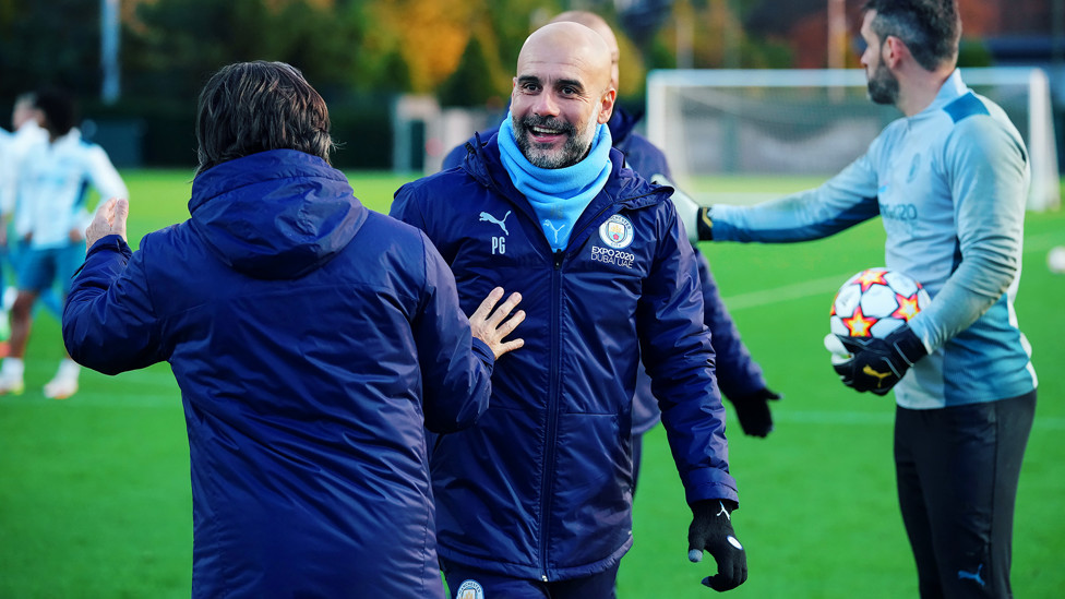 THE BOSS: Pep Guardiola chats with fitness coach Lorenzo Buenaventura