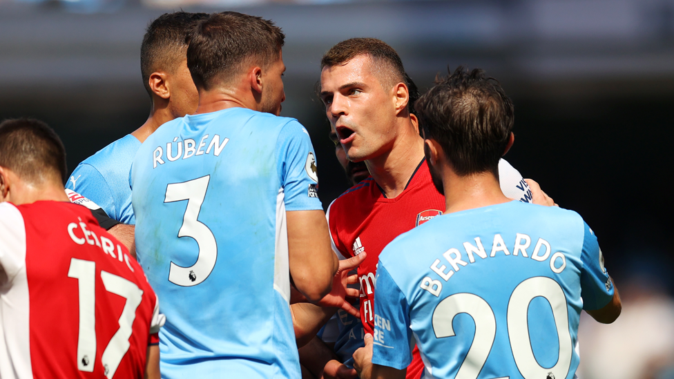 DISMISSED : Granit Xhaka is sent off for a two-footed tackle on Joao Cancelo. 