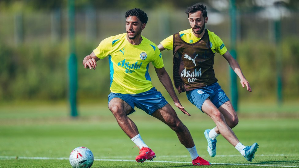 UNDER PRESSURE : Bernardo Silva chases down Omar Marmoush. 