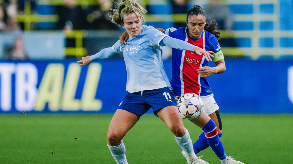 Tussling  : Lauren Hemp getting close attention from PSG 