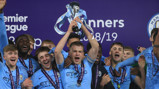GLORY BOYS: Skipper Rowan McDonald lifts the Premier League U18 Cup aloft alongside his joyous City team-mates