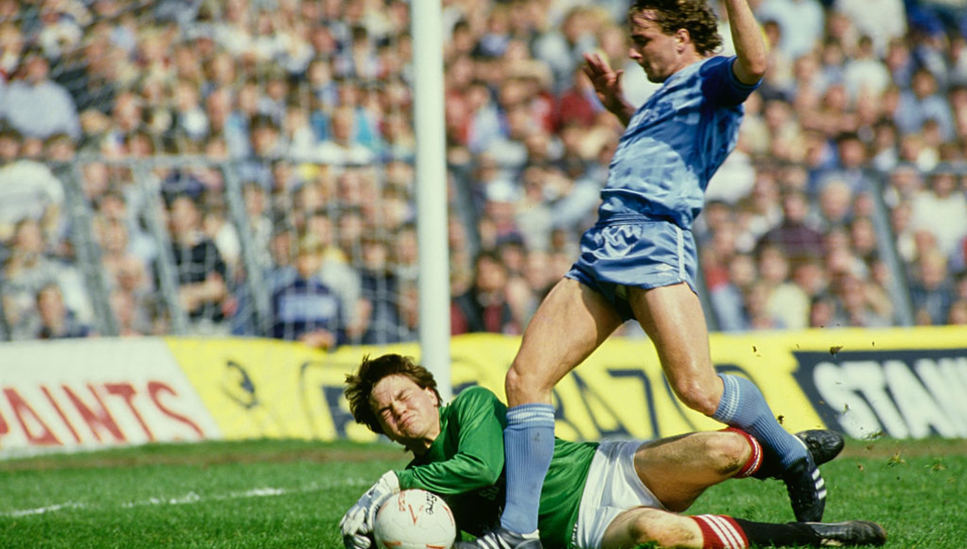 WING COMMAND: Paul Simpson rounds rookie Charlton 'keeper Lee Harmsworth.