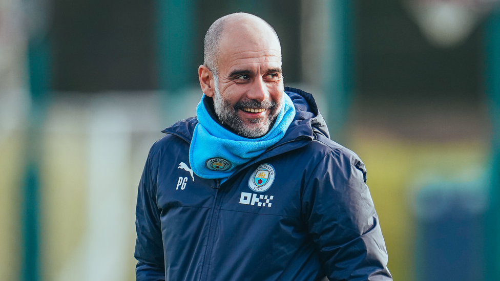 SENYUM KEMENANGAN : Pep Guardiola