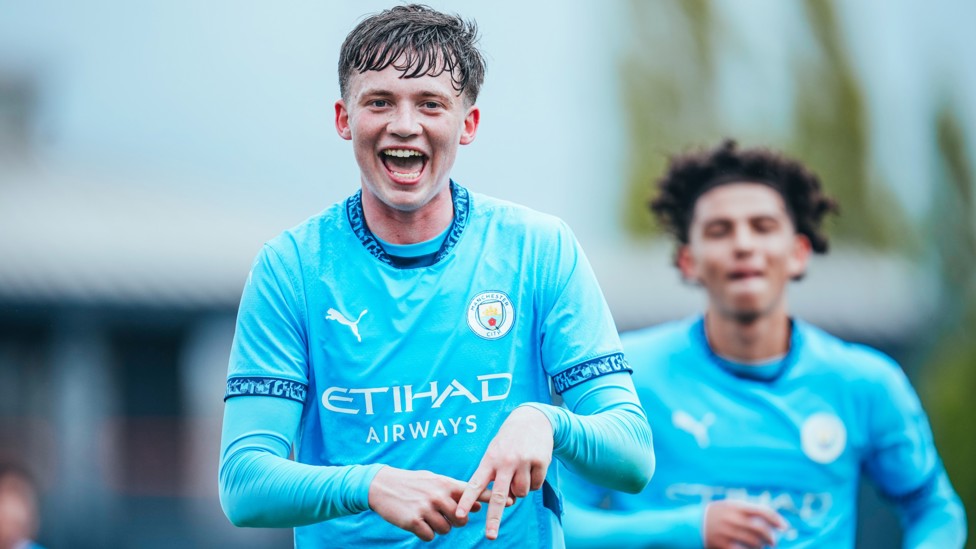 A+  : Kian Noble celebrates his goal in our win at Liverpool. 