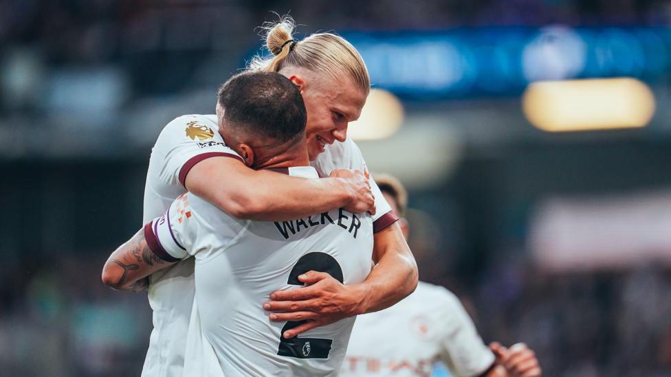 HAALAND HUG : Our number nine shares the love with Walker.