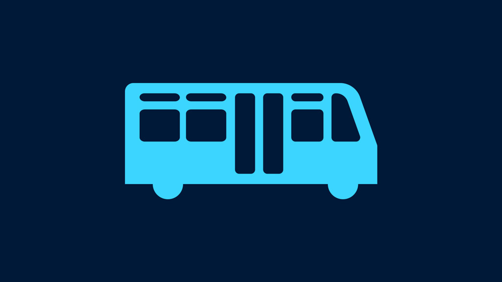 A light blue icon of a bus with windows and wheels on a dark blue background.