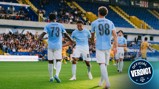 Manchester City youth team players celebrating a goal in blue jerseys with numbers 73, 83, and 98. Crowd and stadium visible in the background.