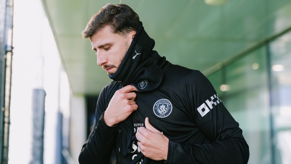 STEPPING OUT : Ruben Dias gets wrapped up to face the elements