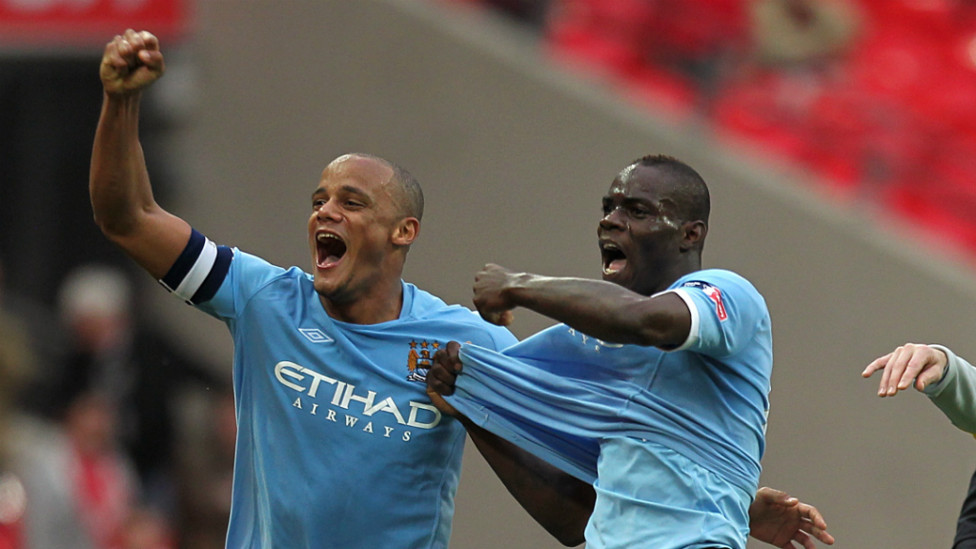 LEADER : Kompany celebrates the 2011 FA Cup win