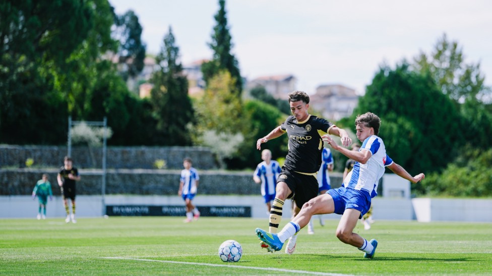 ACTION STATIONS: Kylan Midwood takes the fight to Porto.
