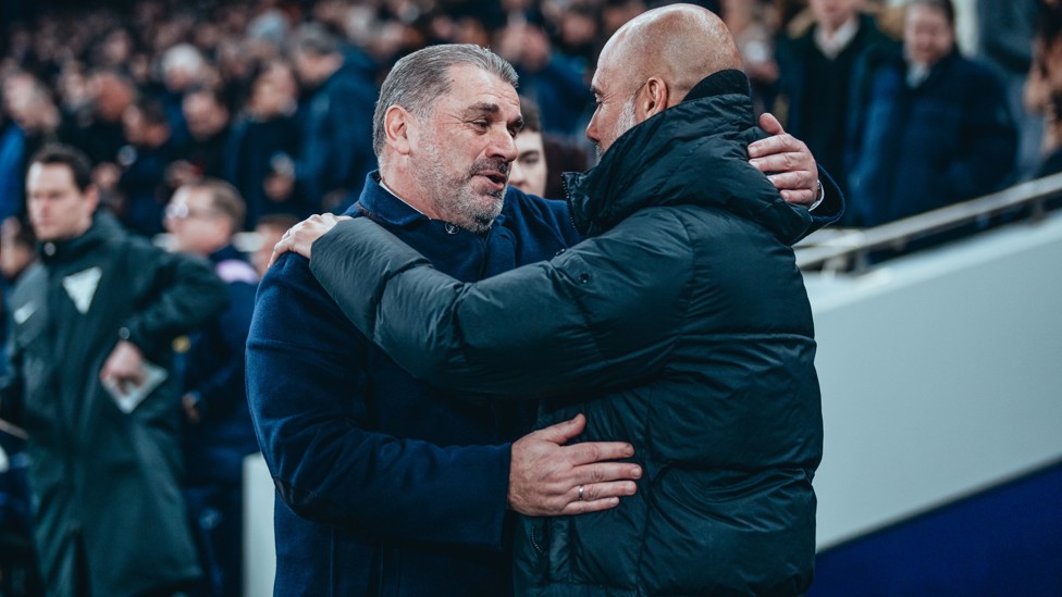 BOSSES : Guardiola and Postecoglou share a warm embrace ahead of kick-off.